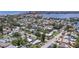 Scenic aerial view showcases the property in a charming neighborhood near a picturesque lake at 257 43Rd Ave, St Pete Beach, FL 33706