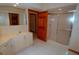 Bathroom featuring a sink with cabinets, a mirror, and a glass door shower stall at 2784 Alexander Dr, Clearwater, FL 33763