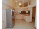 Well-lit kitchen with stainless steel appliances and ample cabinet space at 2784 Alexander Dr, Clearwater, FL 33763