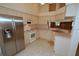 Bright kitchen featuring stainless steel appliances, lots of cabinet space, and tile flooring at 2784 Alexander Dr, Clearwater, FL 33763