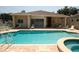Community pool with lounge chairs and umbrellas offers a relaxing outdoor space at 2784 Alexander Dr, Clearwater, FL 33763
