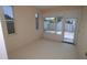 Sunroom with several windows looking out at a fenced-in yard at 2784 Alexander Dr, Clearwater, FL 33763