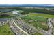 An aerial view of a Primary-planned community, athletic fields, and lush green spaces at 3236 Barbour Trl, Odessa, FL 33556