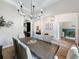 Elegant dining room with a modern chandelier and seamless flow to other living spaces at 3236 Barbour Trl, Odessa, FL 33556