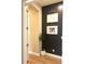 Hallway with a modern black accent wall and neutral paint at 3236 Barbour Trl, Odessa, FL 33556