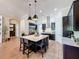 Spacious kitchen with a large island, granite countertops, stainless steel appliances, and modern lighting at 3236 Barbour Trl, Odessa, FL 33556