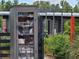 A charming 'Little Free Library' box surrounded by flowers and greenery at 3236 Barbour Trl, Odessa, FL 33556