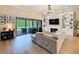 Living room with fireplace, built-in shelves, and view to the outdoor patio at 3236 Barbour Trl, Odessa, FL 33556