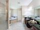 This main bathroom features a glass enclosed shower, soaking tub, and dual sink vanity at 3236 Barbour Trl, Odessa, FL 33556