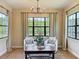 The inviting sitting area offers natural light and neutral tones at 3236 Barbour Trl, Odessa, FL 33556