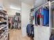 The walk-in closet is spacious with custom shelving, drawers, and hanging space at 3236 Barbour Trl, Odessa, FL 33556