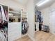 This well-organized walk-in closet includes built-in shelving and ample storage space at 3236 Barbour Trl, Odessa, FL 33556