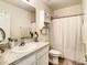 Bathroom featuring a vanity, medicine cabinet, and bathtub and shower combo with white shower curtain at 32977 Kaloko Rd, Wesley Chapel, FL 33543