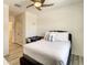 Comfortable bedroom with ceiling fan, wood-look floors, and ample space, providing a peaceful atmosphere at 32977 Kaloko Rd, Wesley Chapel, FL 33543