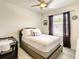 Inviting bedroom with a ceiling fan, soft natural light, and calming neutral tones for relaxation at 32977 Kaloko Rd, Wesley Chapel, FL 33543
