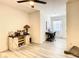 Versatile bonus room with stylish barn doors, tile flooring, and natural light at 32977 Kaloko Rd, Wesley Chapel, FL 33543