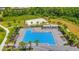 Aerial view of community pool, basketball court, and walking paths at 32977 Kaloko Rd, Wesley Chapel, FL 33543