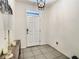 Inviting entryway showcasing neutral walls, and decorative tiling at 32977 Kaloko Rd, Wesley Chapel, FL 33543