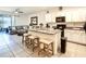 Spacious kitchen and Gathering room combo, featuring granite countertops and stainless steel appliances at 32977 Kaloko Rd, Wesley Chapel, FL 33543