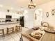 Kitchen featuring stainless steel appliances, white cabinetry, and a granite countertop island at 32977 Kaloko Rd, Wesley Chapel, FL 33543