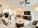 Open-concept living room with a view of the kitchen and dining room at 32977 Kaloko Rd, Wesley Chapel, FL 33543