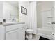 Clean bathroom with a well-maintained vanity, shower, and toilet, showcasing functionality and comfort at 33668 Elm Hill Branch, Wesley Chapel, FL 33545