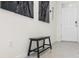 Inviting entryway with a sleek bench and stylish decor, leading into a bright and airy home at 33668 Elm Hill Branch, Wesley Chapel, FL 33545