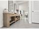Bright entryway with a decorative console table and open sightlines to the living spaces, creating a welcoming atmosphere at 33668 Elm Hill Branch, Wesley Chapel, FL 33545
