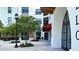 Apartment exterior featuring sidewalk landscaping, building lighting, and covered entryways at 33668 Elm Hill Branch, Wesley Chapel, FL 33545