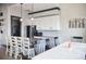 Modern kitchen with granite countertops, stainless steel appliances, and breakfast bar seating at 33668 Elm Hill Branch, Wesley Chapel, FL 33545