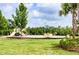 Community playground with slides, swings, and ample green space for outdoor fun at 33668 Elm Hill Branch, Wesley Chapel, FL 33545