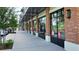 Retail storefront featuring brick columns, storefront windows, and sidewalk access at 33668 Elm Hill Branch, Wesley Chapel, FL 33545