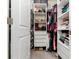 Organized walk-in closet with shelving, drawers, rods and plenty of storage space for clothing and accessories at 33668 Elm Hill Branch, Wesley Chapel, FL 33545