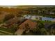 Beautiful home with lush landscaping and water view in a desirable neighborhood at 3895 Mimosa Pl, Palm Harbor, FL 34685