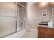 Bathroom features a shower, vanity, and tile flooring, providing a clean and functional space at 3895 Mimosa Pl, Palm Harbor, FL 34685