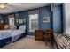 Relaxing bedroom showcases four-poster bed, ceiling fan, desk, and bright windows with decor at 3895 Mimosa Pl, Palm Harbor, FL 34685