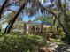 Picturesque gazebo with a blue roof surrounded by greenery at 3895 Mimosa Pl, Palm Harbor, FL 34685