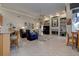 Open-concept living room with fireplace and breakfast nook at 3895 Mimosa Pl, Palm Harbor, FL 34685