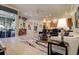 Open-concept living space with kitchen, dining area, and large windows at 3895 Mimosa Pl, Palm Harbor, FL 34685