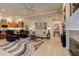 Spacious living room with fireplace, open floor plan, and dining area at 3895 Mimosa Pl, Palm Harbor, FL 34685