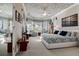 Bright main bedroom with large bay windows and sitting area that provides space and natural light at 3895 Mimosa Pl, Palm Harbor, FL 34685