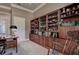 Spacious office includes lots of wooden built-ins and natural light at 3895 Mimosa Pl, Palm Harbor, FL 34685