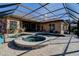 Inviting pool and spa area with a screened enclosure, complemented by brick patio and views of the property at 3895 Mimosa Pl, Palm Harbor, FL 34685
