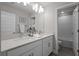 Well-lit bathroom features dual sinks, ample counter space, and a mirror at 4077 Cadence Loop, Land O Lakes, FL 34638
