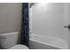 Bright bathroom features a shower and tub combination with white subway tile at 4077 Cadence Loop, Land O Lakes, FL 34638