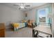Bright bedroom features a desk, closet space and plenty of natural light at 4077 Cadence Loop, Land O Lakes, FL 34638