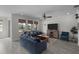 Inviting living room boasts modern furnishings, a ceiling fan, natural light, and elegant decor at 4077 Cadence Loop, Land O Lakes, FL 34638