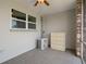 Enclosed porch area with gray tile flooring and a window, ideal for relaxation at 416 73Rd N Ave # 205, St Petersburg, FL 33702
