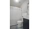 Updated bathroom with modern vanity, decorative floor tiles, and shower with striped curtain at 416 73Rd N Ave # 205, St Petersburg, FL 33702