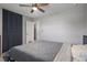 Bedroom features a queen-sized bed, ceiling fan, closet and muted gray walls at 416 73Rd N Ave # 205, St Petersburg, FL 33702